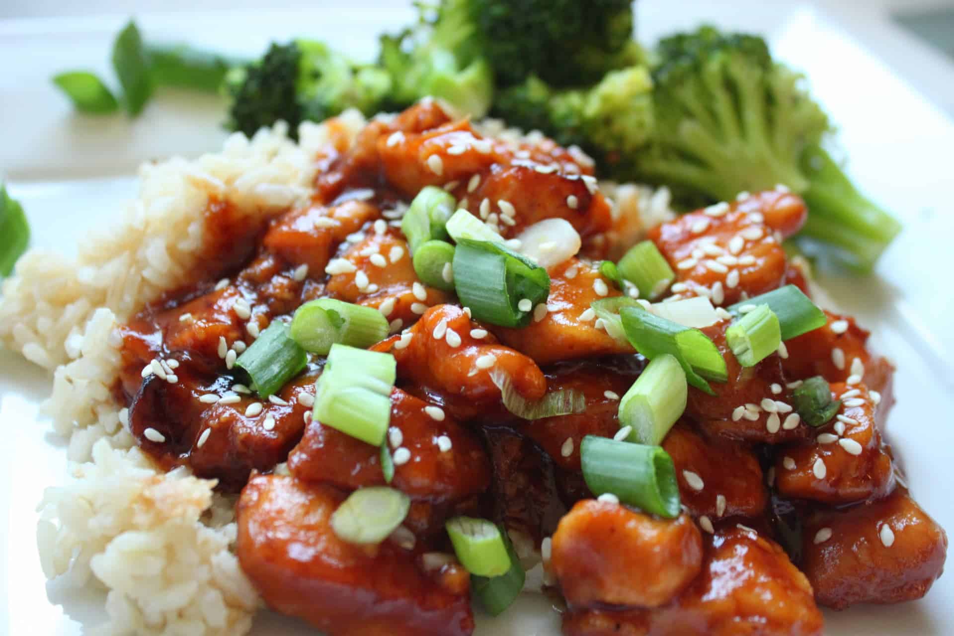 Crockpot Orange Chicken with Broccoli, Green Onions, and Sesame Seed, on a Bed of Rice