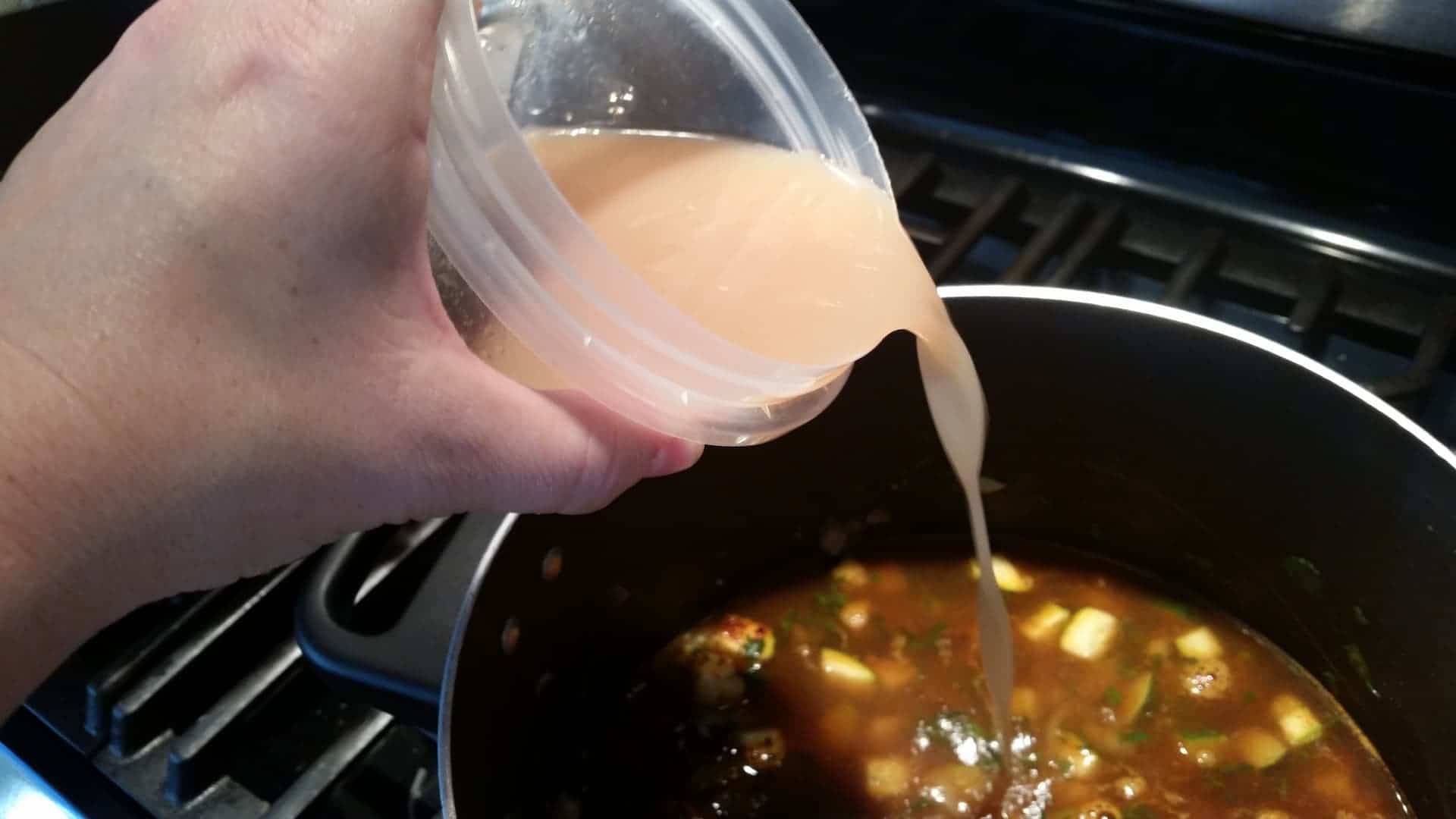 Adding Homemade Chicken Stock to the Chicken Tortilla Soup