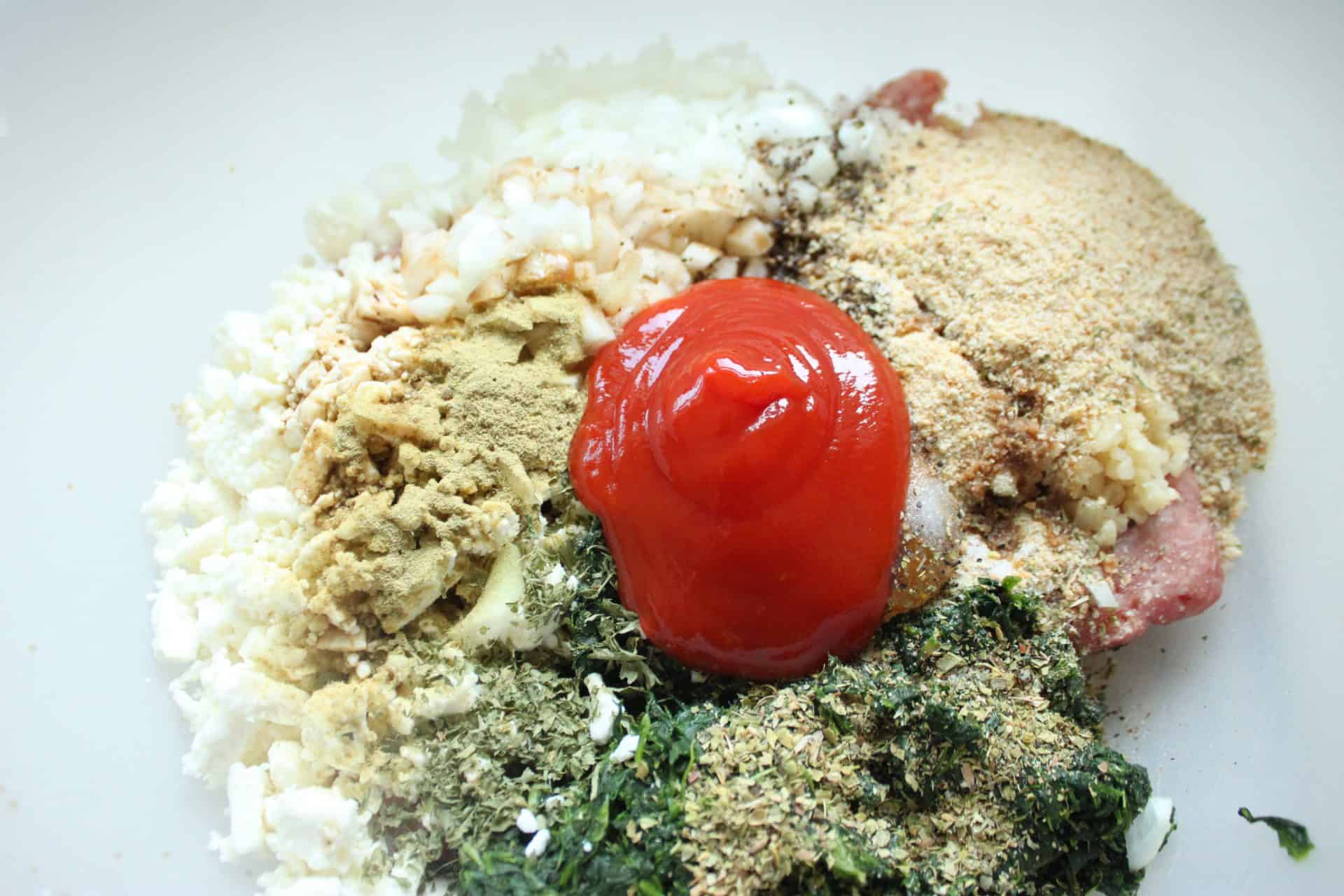 Adding seasoning to greek meatloaf
