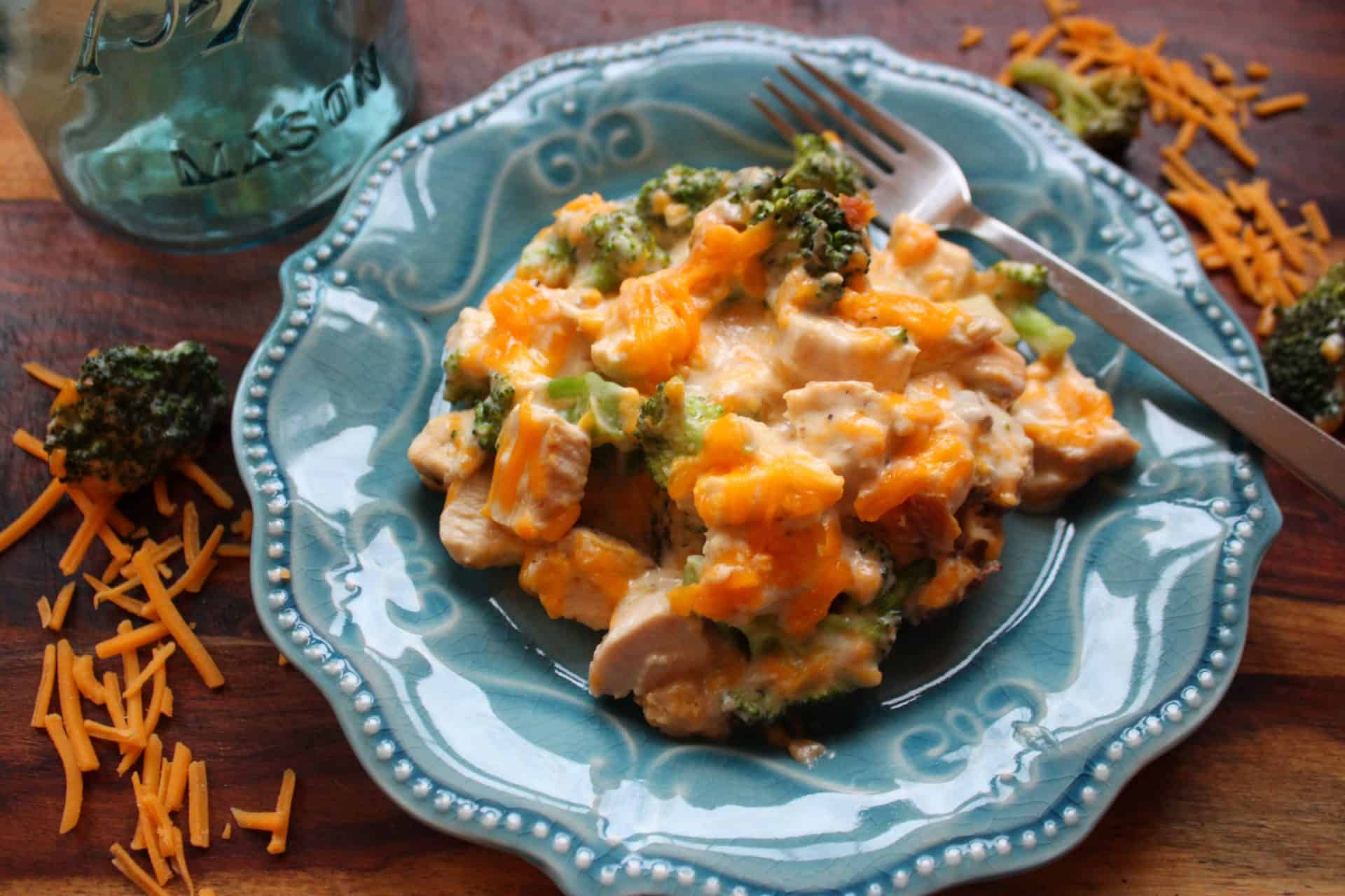 Delicious 30-Minute Chicken and Broccoli Casserole for Busy Nights 7 A single portion of chicken and broccoli casserole on a blue plate, creamy and loaded with cheese, broccoli, and tender chicken.