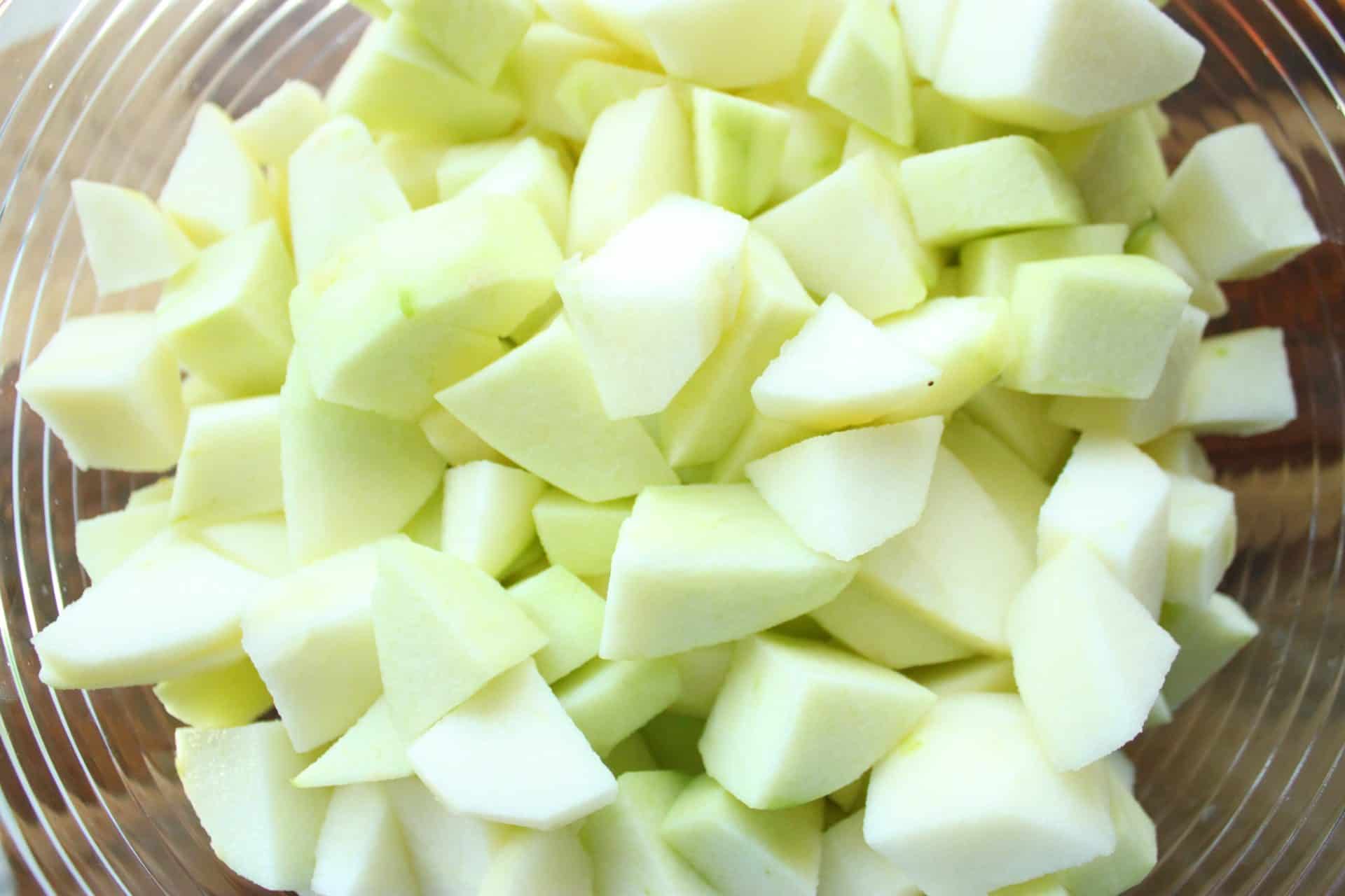 Cozy Up with This Simple Crockpot Cinnamon Applesauce Recipe 2 Glass Bowl Full of Chunked Granny Apples