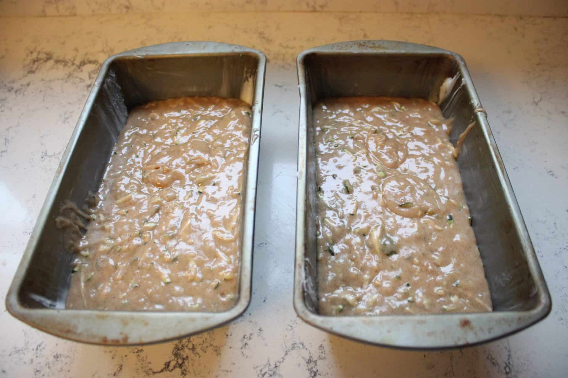 10 Simple Steps to Perfect Cinnamon Zucchini Bread 5 Cinnamon Zucchini Bread Dough Poured into Metal Loaf Bread Pans