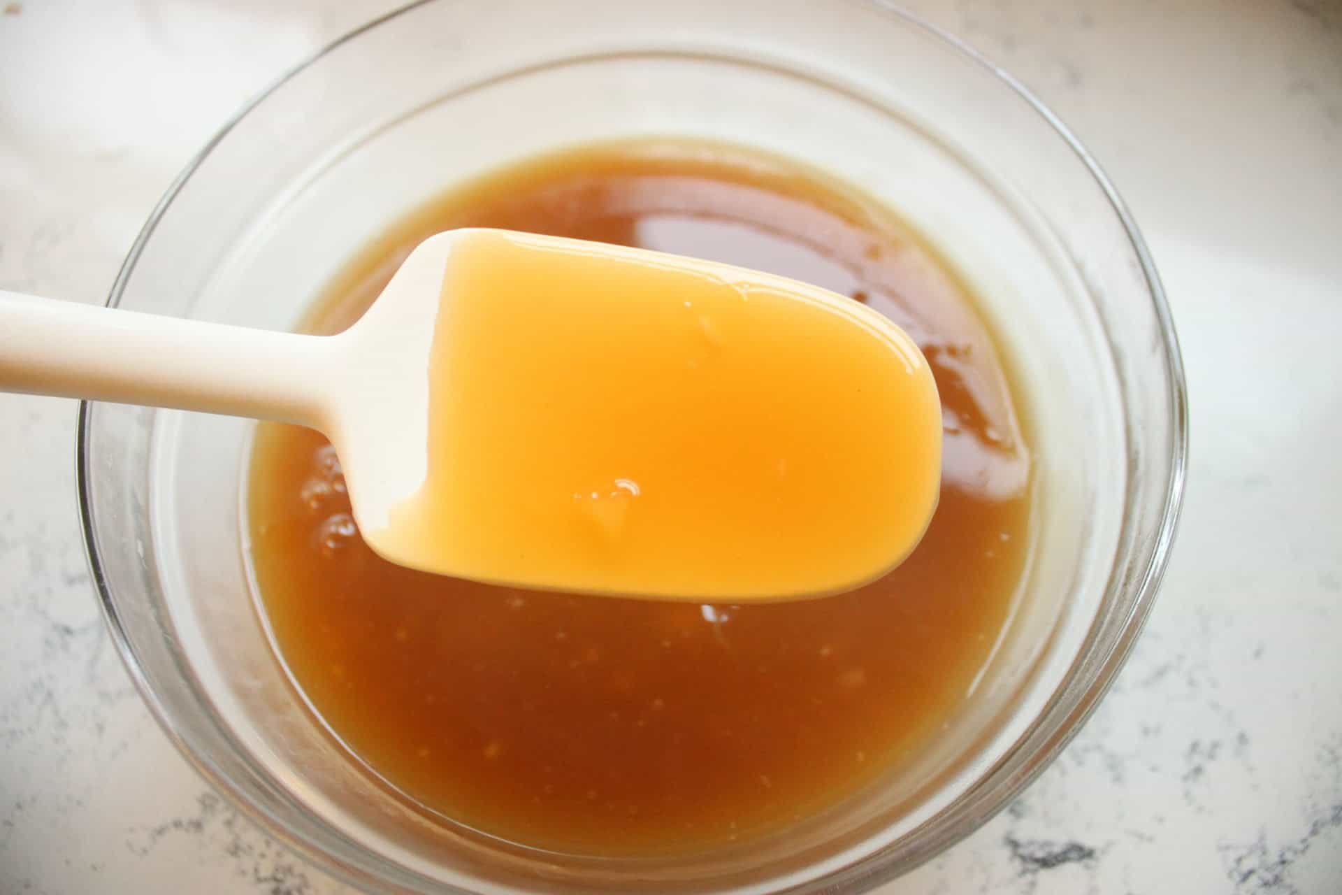 Crockpot Hawaiian Meatballs: Sweet, Savory, and Effortless to Make 5 Stirring Crockpot Hawaiian Meatballs Sauce in a Glass Bowl