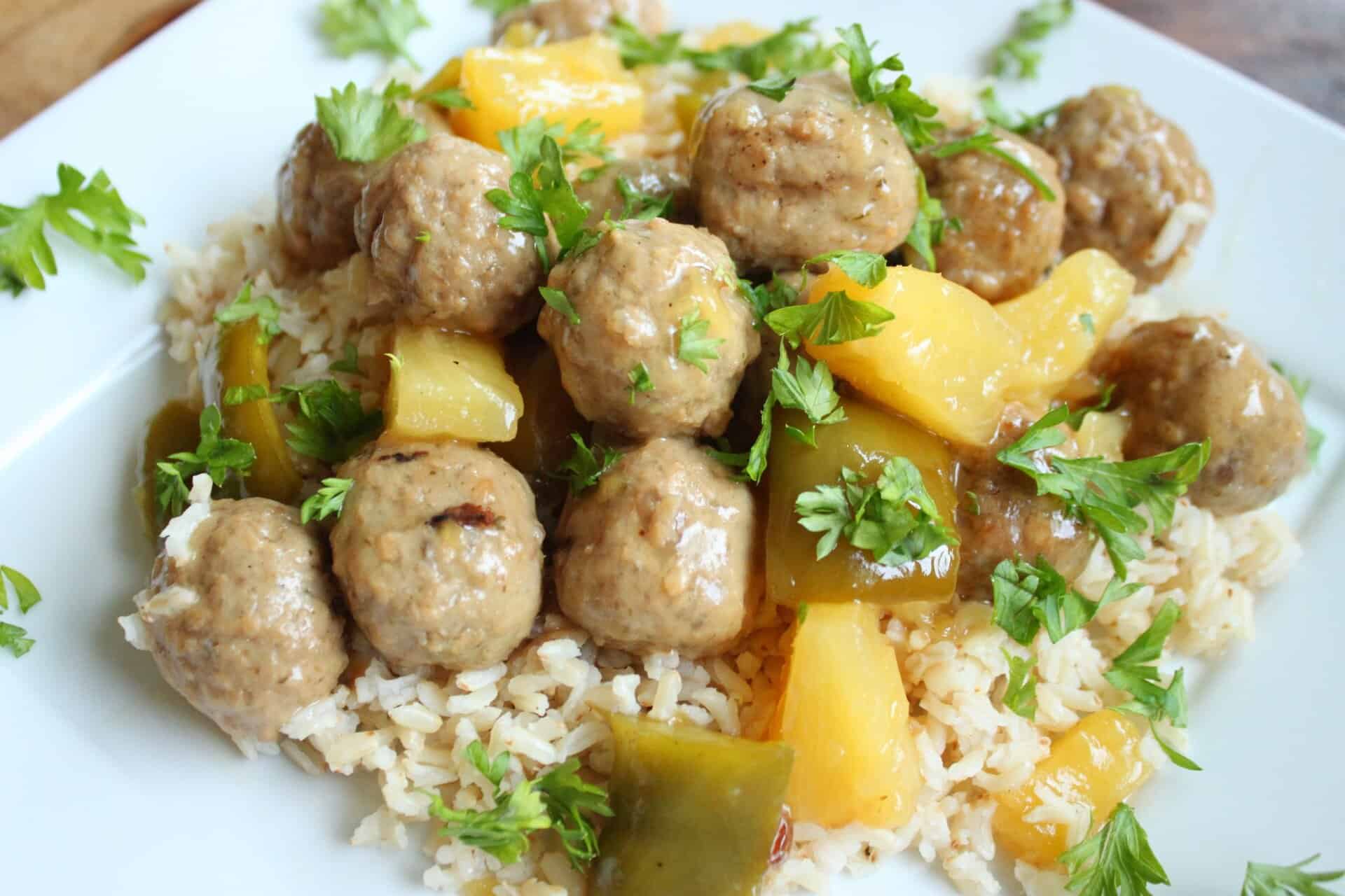 Crockpot Hawaiian Meatballs: Sweet, Savory, and Effortless to Make 11 Plate of Crockpot Hawaiian Meatballs on a Bed of Rice