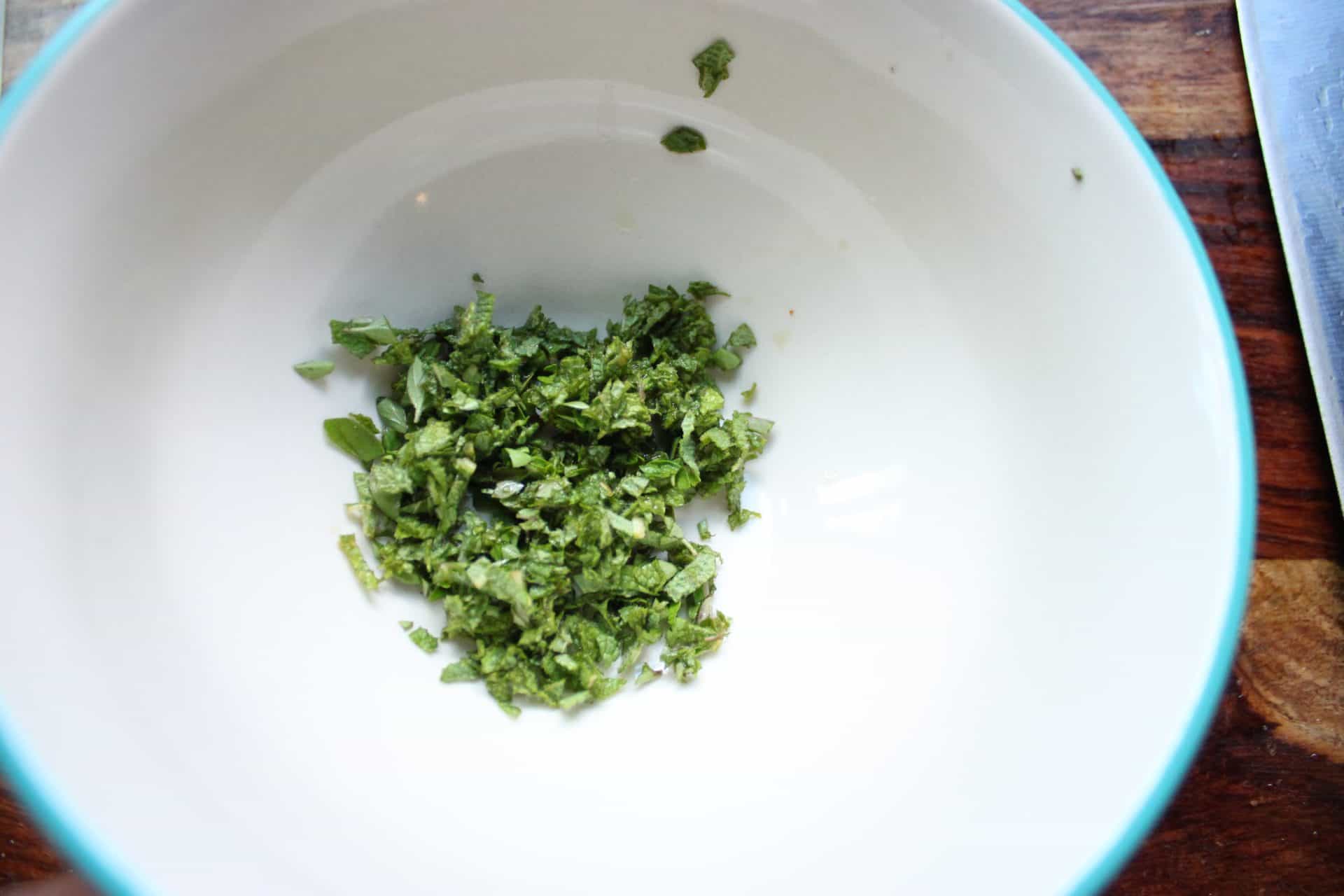 Diced Sage and Oregano Herbs in a Bowl