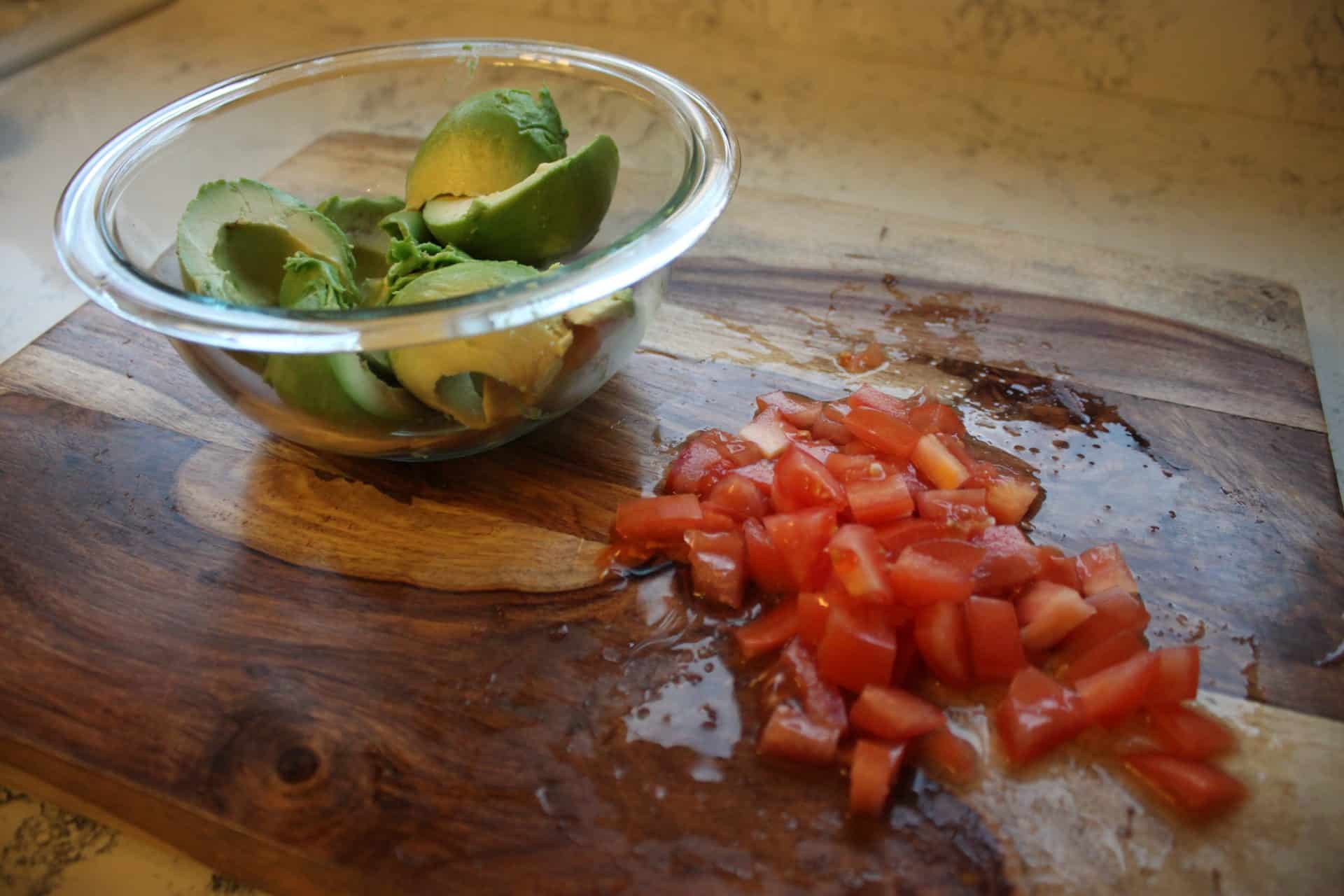 Diced Tomatos and Cut Avocados on a Cutting Board