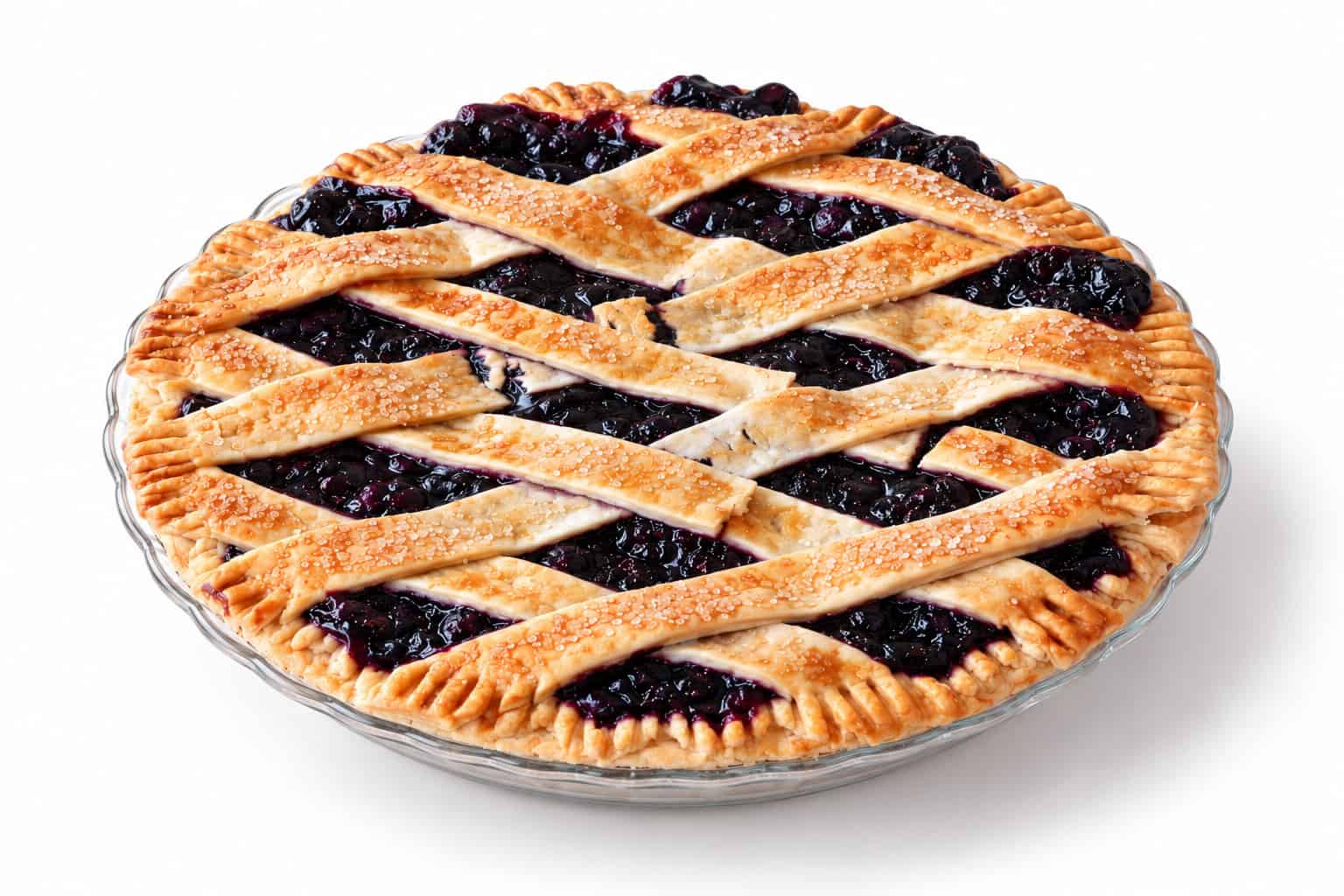 Blueberry Pie 2 Whole blueberry lattice pie viewed at an angle, showing golden crust, dark berry filling, and crimped edge.