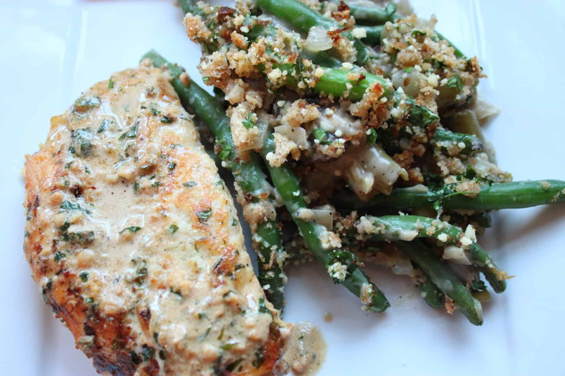 Healthy Green Bean Casserole with a Side of Creamy Herb Chicken on a Square Plate