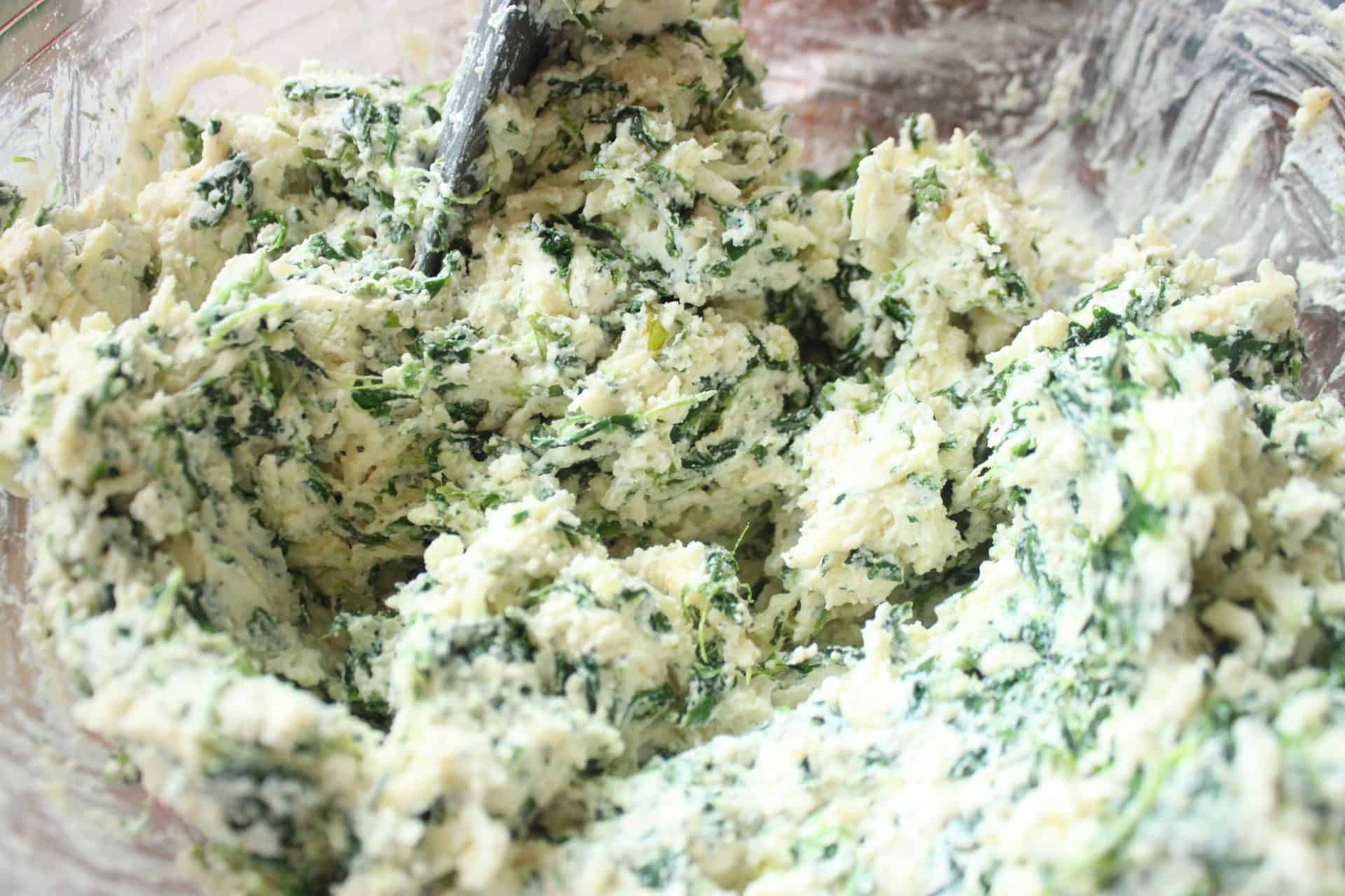 Freezer-Friendly Spinach Manicotti: A Comfort Meal for New Moms 2 Herbs, Spinach, Ricotta Cheese, and Spices Mixed in a Glass Bowl