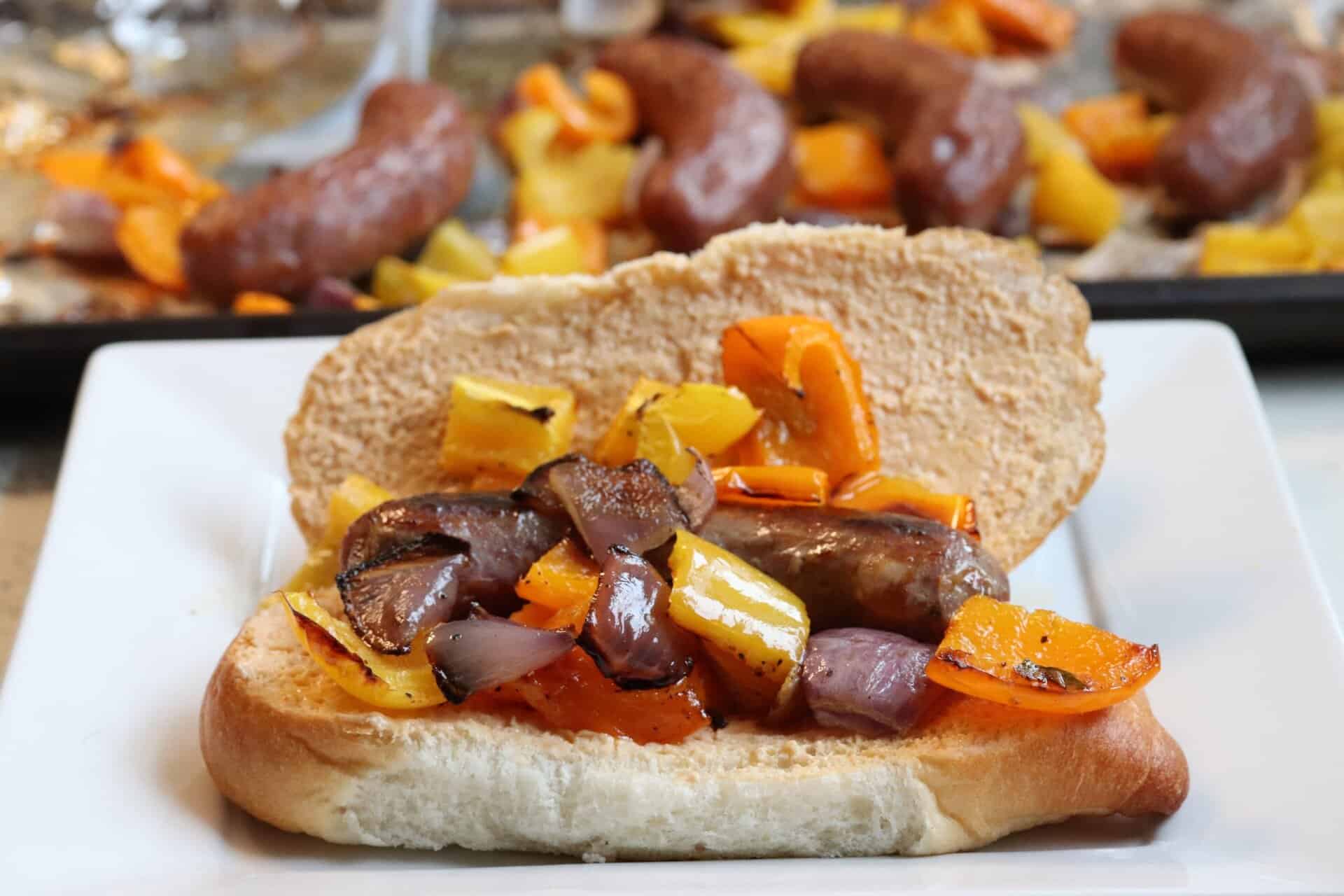 Italian sausage hoagie sandwiches filled with roasted onions and bell peppers, served on a toasted roll with creamy spread.