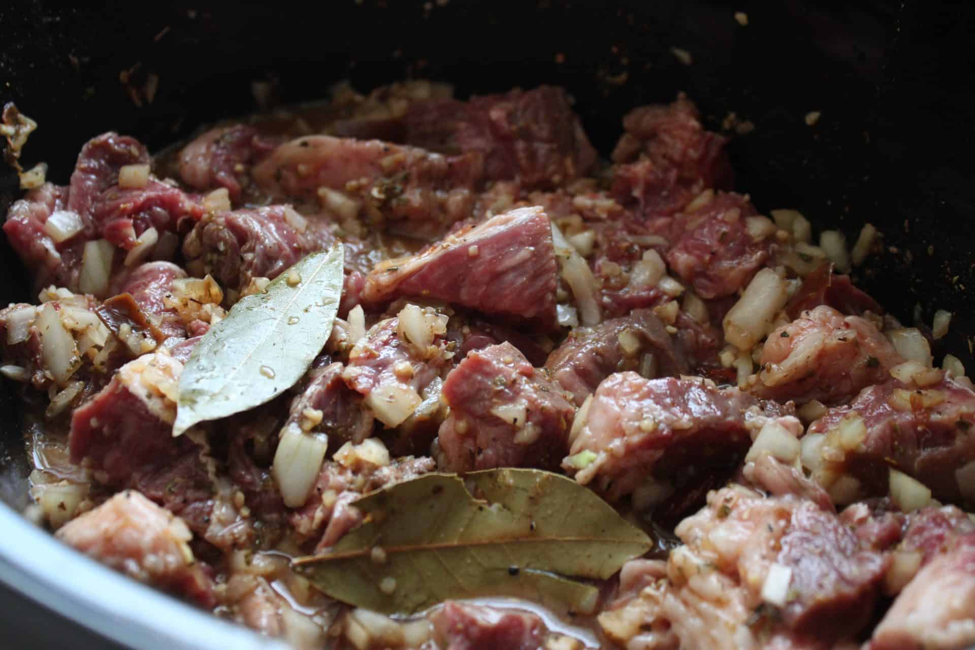 Ingredients and Meat Mixed Together for Crockpot Chipotle Barbacoa Chuck Roast