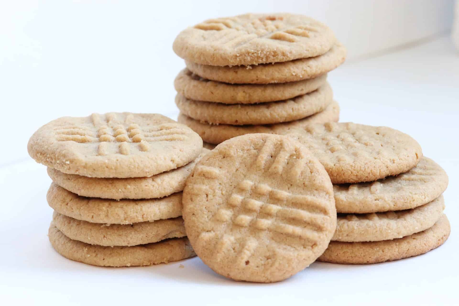 A taller stack of 3 Ingredient Peanut Butter Cookies, showing slight texture variations—perfect for adding mix-ins like chocolate or candy.
