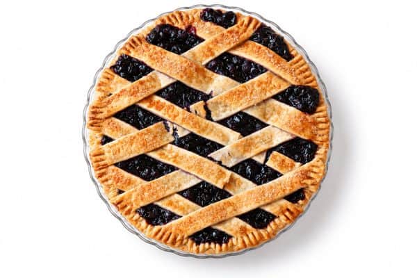 Blueberry Pie 3 Overhead view of blueberry pie with golden sugar-topped lattice crust and dark blueberry filling.