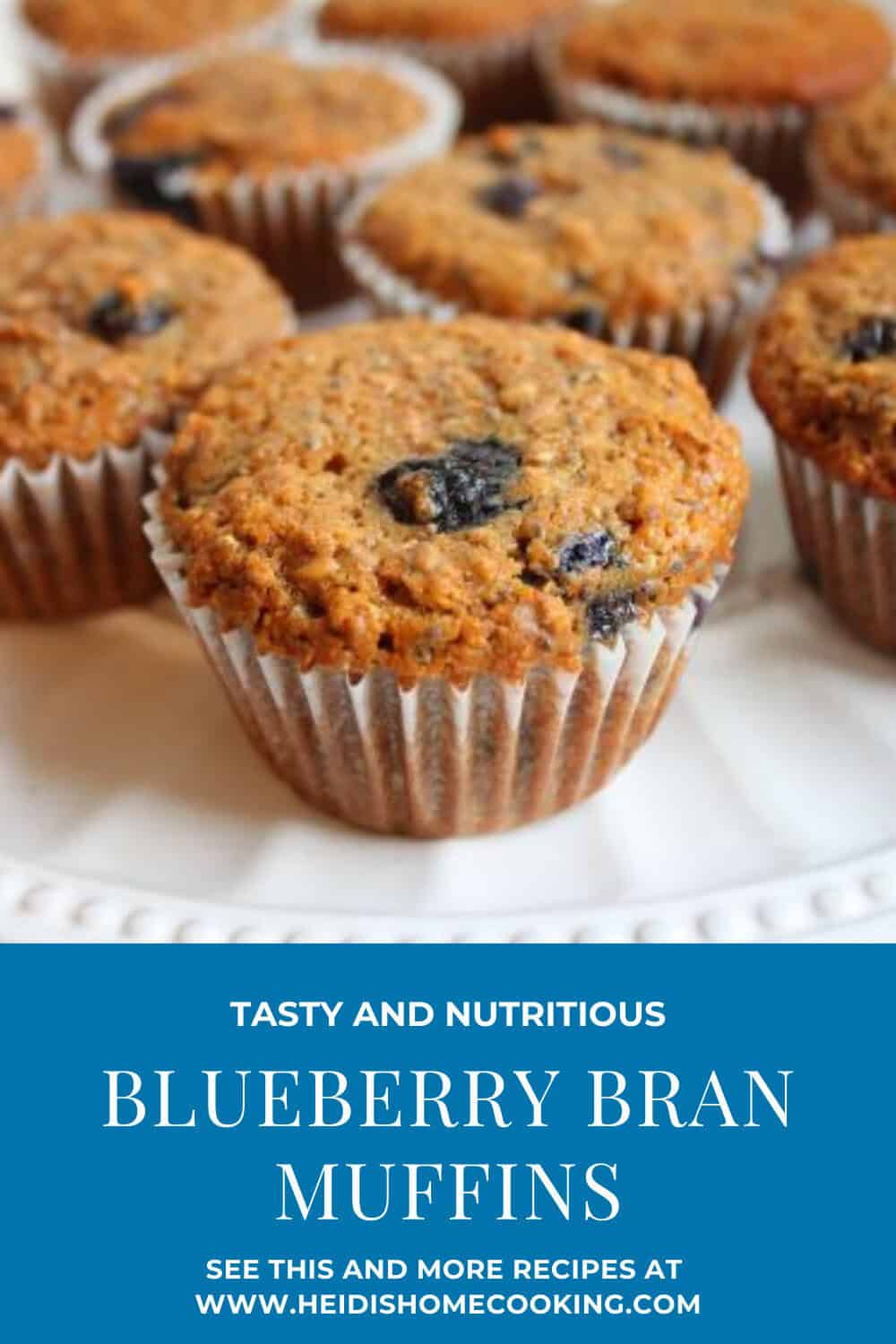 Freshly baked healthy blueberry bran muffins in paper liners, set close together with text overlay for saving or pinning this fiber-rich recipe.