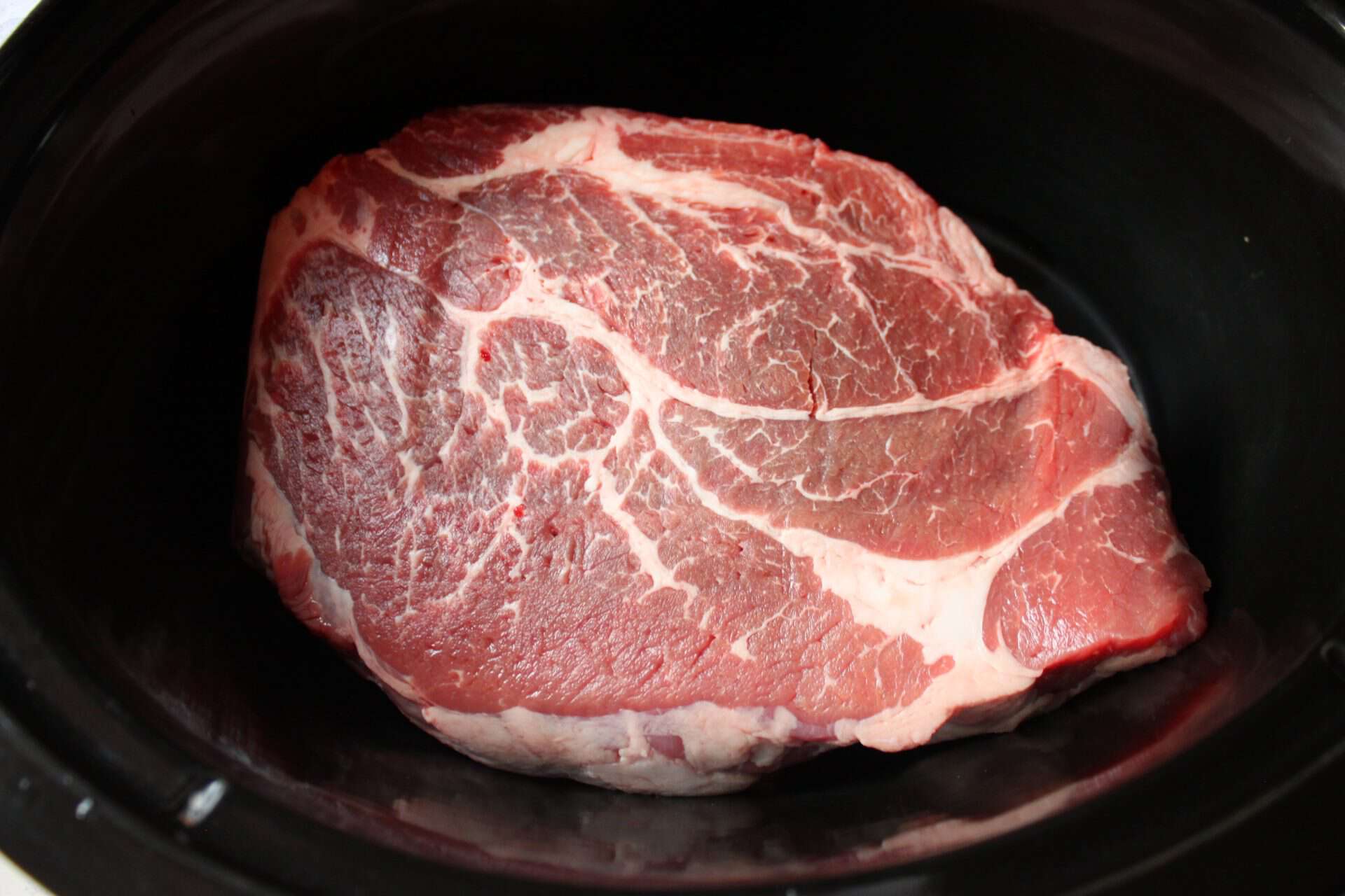Irresistible Crockpot Pork Shoulder: A Flavorful Slow Cooked Delight 2 Pork Shoulder in Crockpot Sitting in Bottom of Crockpot