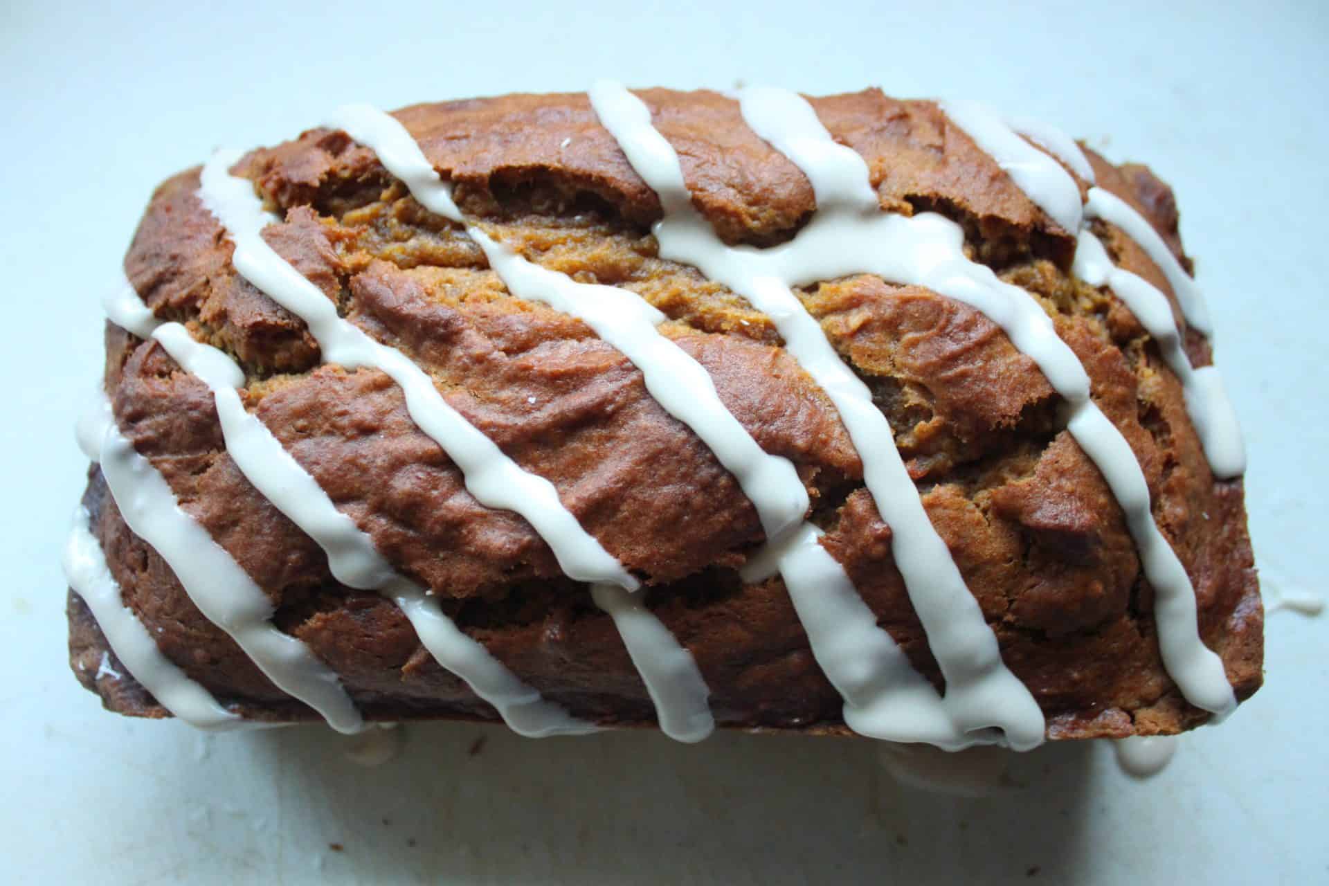 Pumpkin Bread with Vanilla Frosting Drizzled on Top