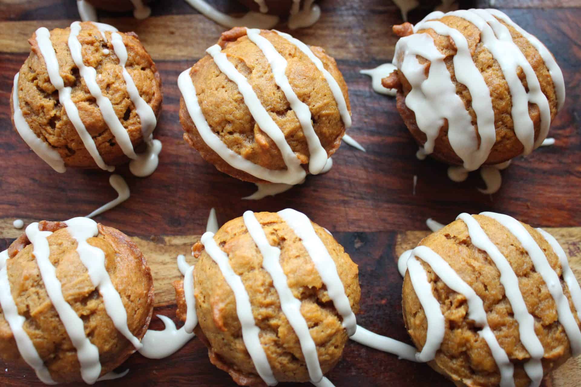 Pumpkin Muffins Sitting on a Wooden Cutting Board