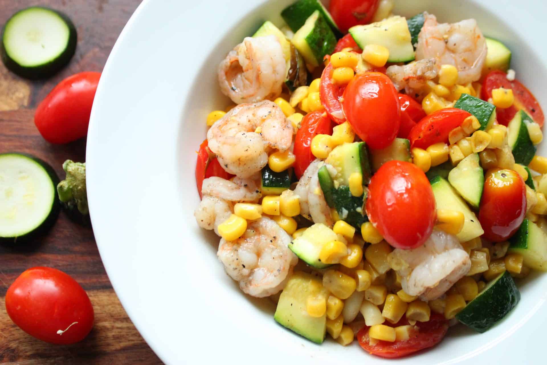 Refreshing Summer Shrimp Stir-Fry in a White Bowl on a Wood Counter