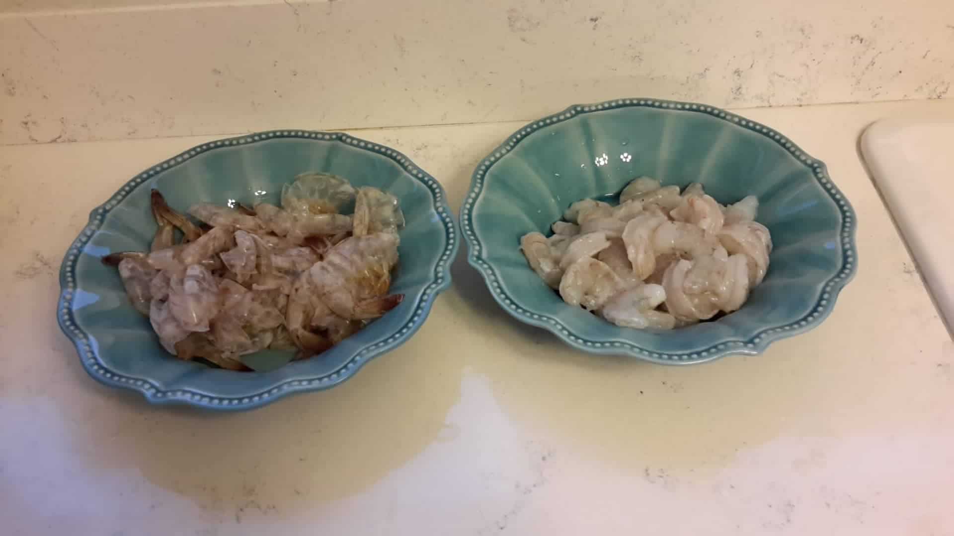 Master How to Peel and Devein Shrimp in 3 Foolproof Steps! 5 Shrimp With Shell Removed Seperated into Different Bowls