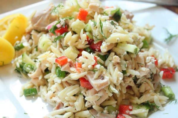 Lemon chicken orzo topped with crumbled goat cheese for a creamy finish, adding richness and contrast to the fresh, citrusy flavors.
