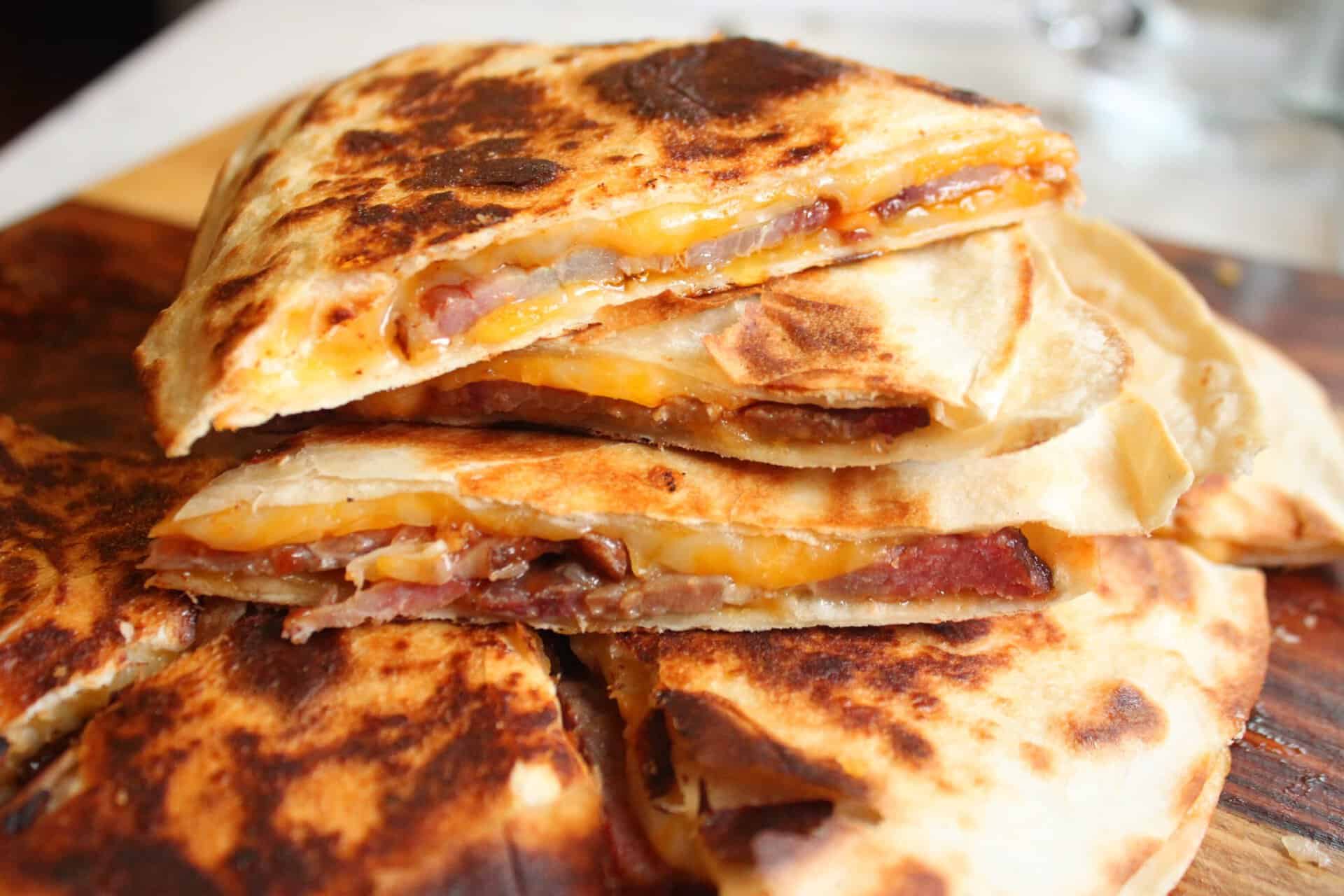 4-Ingredient BBQ Brisket Quesadillas Your Family Will Devour 7 Up Close Picture of a Stack of Sliced BBQ Brisket Quesadilla