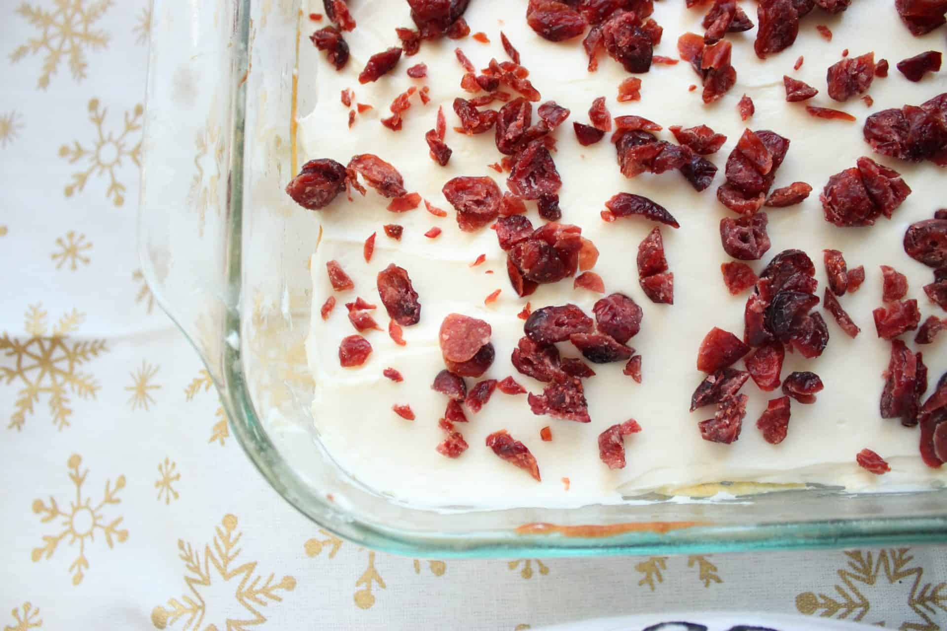 Easy Recipe for Copycat Starbucks White Chocolate Cranberry Bliss Bars 5 Pan of Starbucks white chocolate cranberry bliss bars, ready to slice and serve or chill in the fridge to set the frosting.